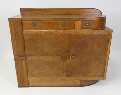 Lot 435 - An Art Deco oak ledgeback sideboard, having...