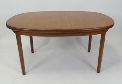 Lot 470 - A 1960s teak D-end extending dining...