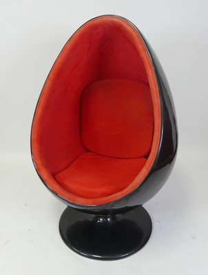 Lot 522 - After Eero Aarnio - a black painted fibreglass...