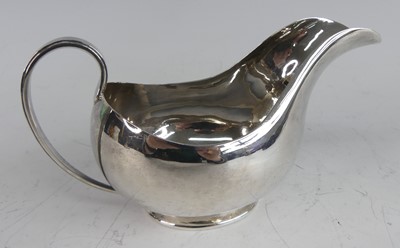 Lot 187 - A late Art Deco silver sauceboat, of plain...