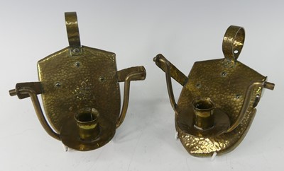 Lot 236 - A pair of Arts & Crafts hammered brass wall...