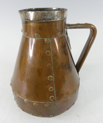 Lot 241 - An Arts & Crafts riveted copper water jug, of...