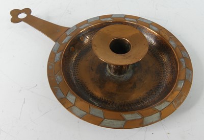 Lot 237 - Harold Holmes - a hammered copper chamberstick,...