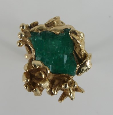 Lot 223 - A 1970s yellow gold and emerald rough cut...