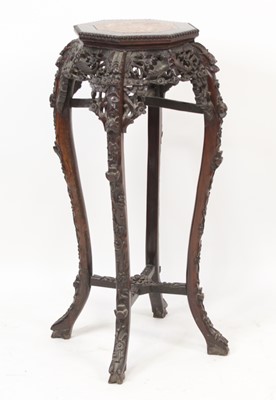 Lot 2275 - A Chinese carved rosewood jardiniere stand, of...