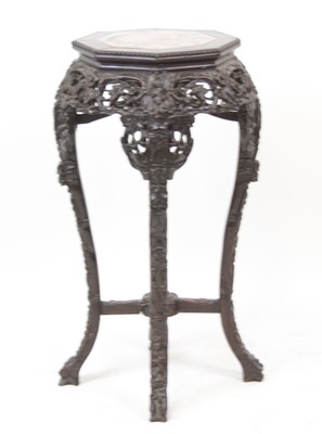 Lot 2276 - A Chinese carved rosewood jardiniere stand, of...