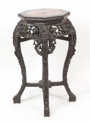 Lot 2555 - A Chinese carved rosewood jardiniere stand, of...