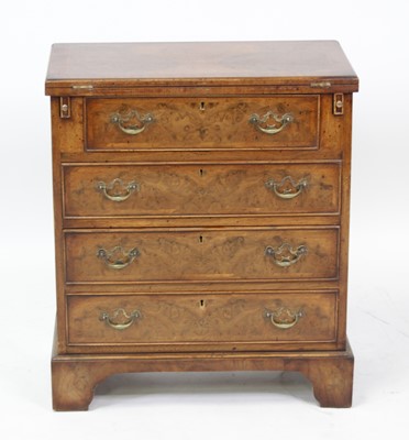 Lot 2665 - A walnut and figured walnut bachelors chest in...