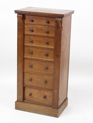 Lot 2728 - A Victorian oak Wellington chest, having seven...