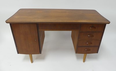 Lot 485 - A 1960s Danish teak kneehole writing desk,...