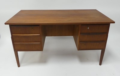 Lot 487 - A 1960s Danish teak kneehole writing desk,...