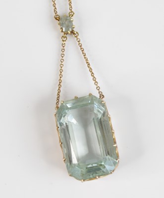 Lot 2363 - A 9ct gold and aquamarine pendant on finelink...