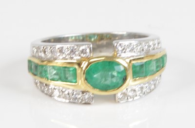 Lot 2403 - A modern white metal, emerald and diamond half...