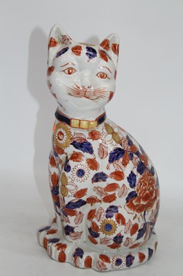 Lot 45 - A modern Chinese pottery model of a cat, in...