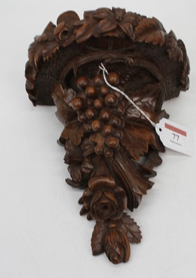 Lot 77 - A continental carved beech wall bracket in the...