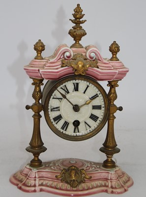 Lot 30 - A continental porcelain cased mantel clock,...