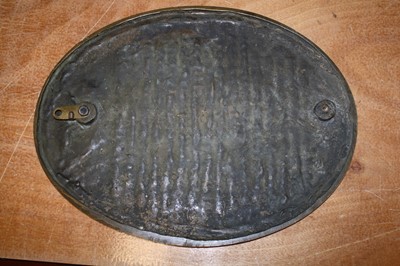 Lot 515 - A large bronze wall plaque of oval form,...