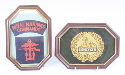 Lot 561 - A collection of cap badges, mounted with cloth...