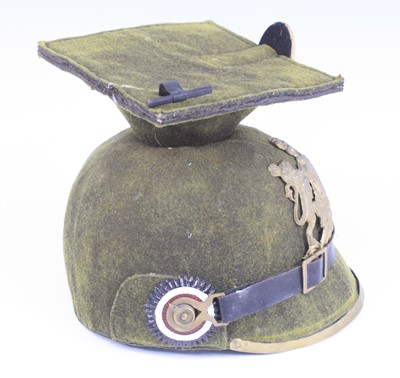 Lot 520 - A Wurttemberg Uhlan helmet, in green felt,...