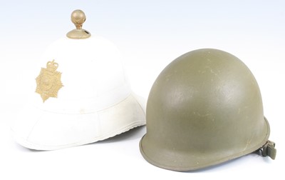 Lot 608 - A Royal Marines dress helmet, having a brass...