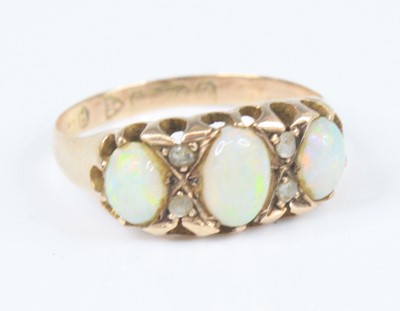 Lot 4148 - A 9ct rose gold, opal and diamond half hoop...