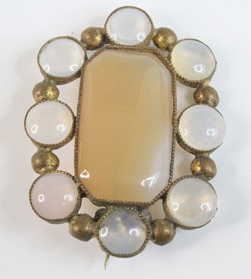 Lot 4149 - A yellow metal chalcedony oval panel brooch,...