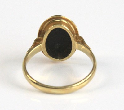 Lot 2518 - A yellow metal opal triplet ring, the black...