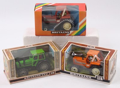 Lot 1631 - Britains 1/32nd scale boxed tractor group, 3...