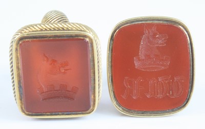 Lot 4154 - Two yellow metal carnelian fob seals, one with...