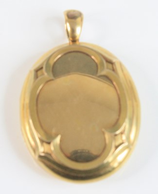 Lot 4144 - A yellow metal oval locket, having a raised...