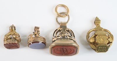 Lot 4155 - Four assorted yellow metal fob pendants, being...