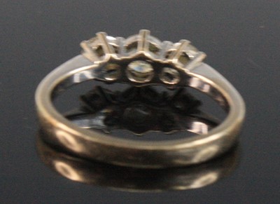 Lot 2519 - An 18ct white gold diamond three stone ring,...