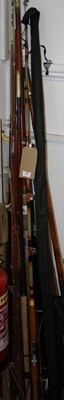 Lot 700 - A collection of various fishing rods, mostly...