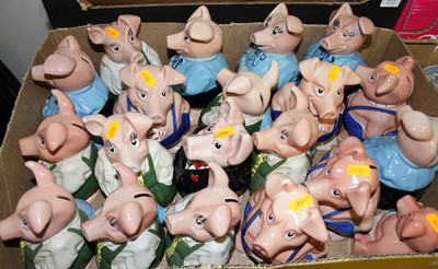 Lot 698 - A collection of Wade Nat West piggy banks