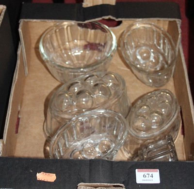 Lot 674 - A collection of six vintage moulded glass...