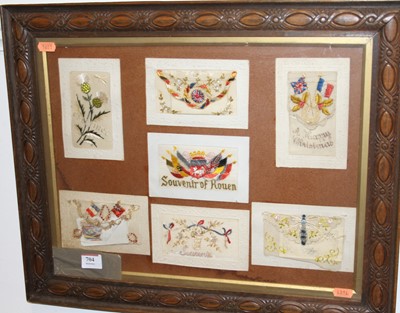 Lot 704 - A framed display of World War One silk...