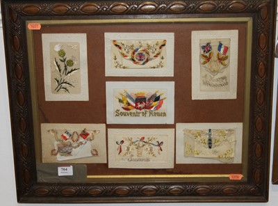 Lot 704 - A framed display of World War One silk...