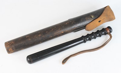 Lot 724 - A lignum vitae truncheon, having a turned...