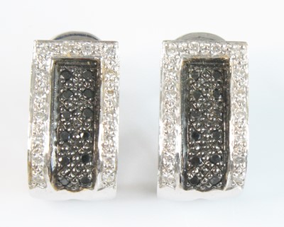 Lot 2530 - A pair of white metal diamond multi-stone...