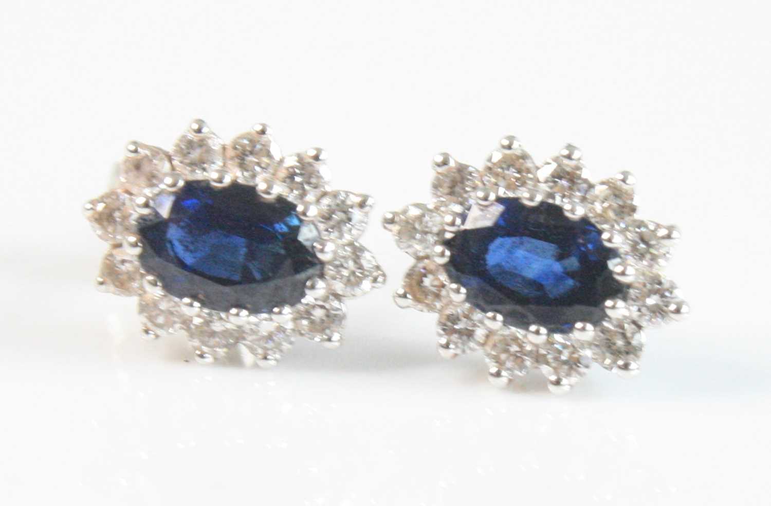 Lot 2533 - A pair of 18ct white gold, sapphire and...