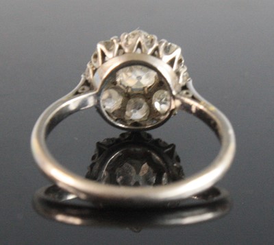 Lot 2534 - A white metal diamond circular cluster ring,...