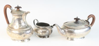 Lot 2129 - A George V silver three-piece tea set,...