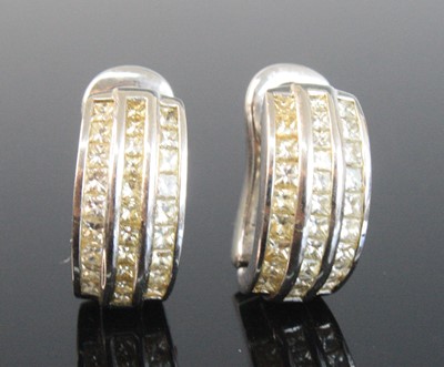 Lot 2163 - A pair of 18ct white gold half hoop earrings,...