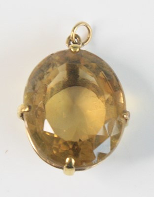 Lot 2634 - A yellow metal citrine pendant, featuring an...