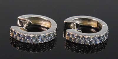 Lot 2638 - A pair of 18ct white gold hinged huggy hoop...