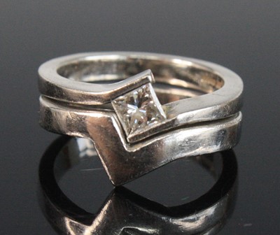 Lot 2639 - Two rings, being a platinum diamond crossover...