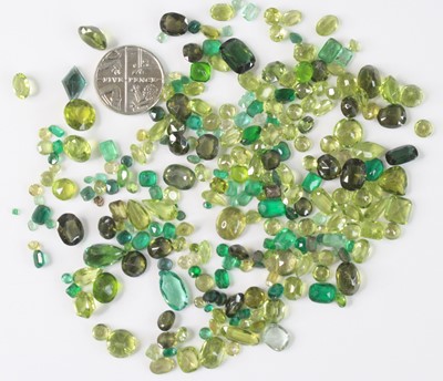 Lot 2601 - A collection of loose green peridot stones, of...