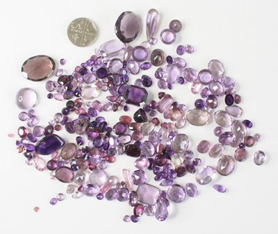 Lot 2603 - A collection of loose cut amethyst stones, to...