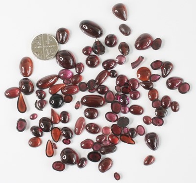 Lot 2605 - A collection of loose garnet cabochons,...