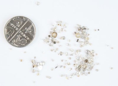 Lot 2608 - A collection of loose small diamonds, to...